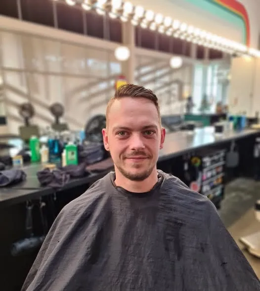 Smiling client with a fresh cut by Jill